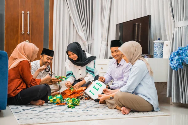 Muslim youth group making and preparing Ramadan decorations at home