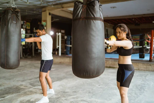 Male Female Boxer Hitting Sand Bag Boxing Coach Partner Gym — Stock Photo, Image