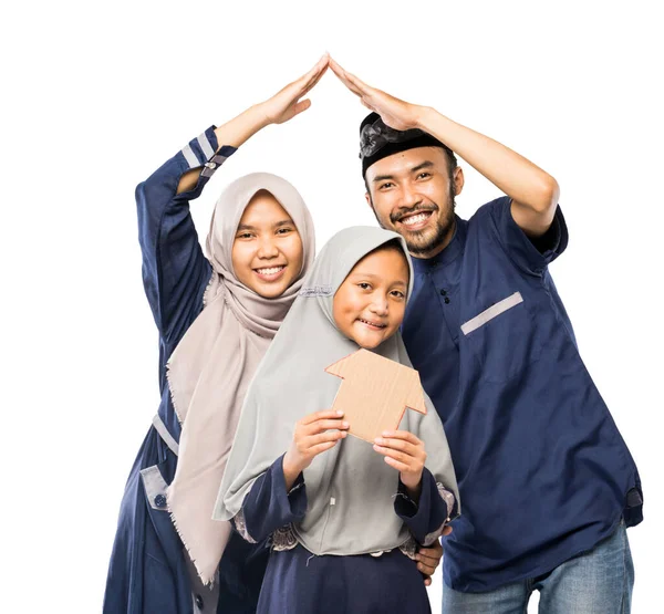 muslim family protection concept making a house gesture and roof as a home