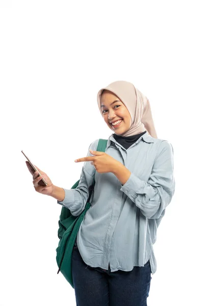 Smiling Asian Muslim Female Student Pointing Cell Phone White Background — Stock Photo, Image
