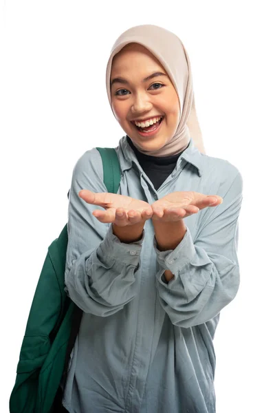Close Cheerful Veiled Asian Female University Student Presenting Something Isolated — Stock Photo, Image