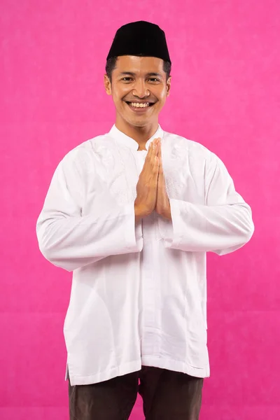 Asian Young Man Greeting Gesture Cap Pink Background — Stock Photo, Image