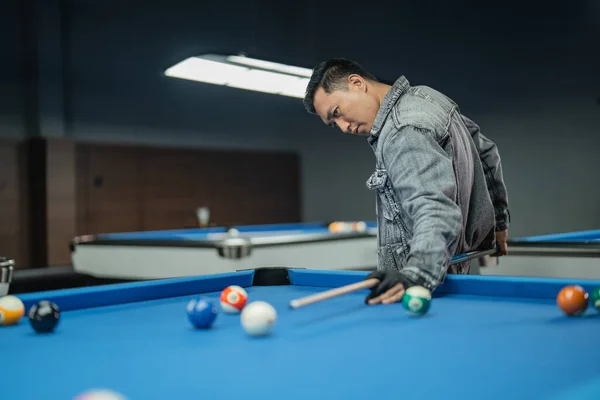 Male Pool Player Poking Cue Ball His Back While Playing — Stock Photo, Image