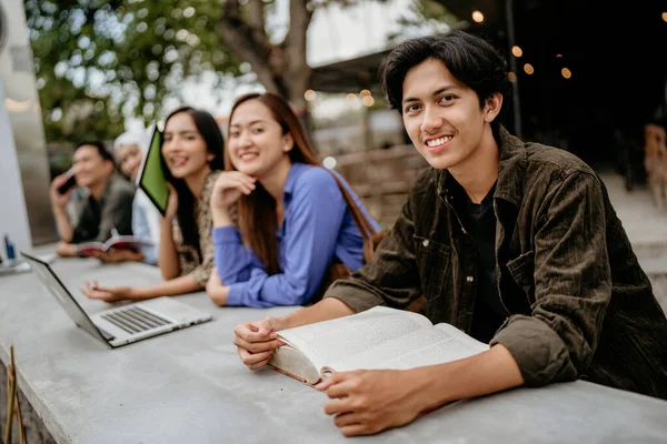 Handsome Male University Student Smiles Camera While Studying Group Outdoor — Stock Photo, Image