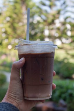 Woman hold her iced coffee, stock photo