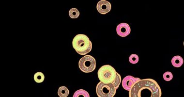 Siyah ekrana tanecikler serpiştirilmiş çeşitli renkli çörekler. Renkli kremalı ve şekerli çörekler. Tatlı. Fırın ve şekerleme. 4K hareket grafiksel canlandırma yukarı doğru hareket