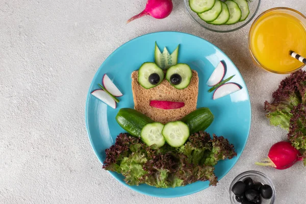 Frog vegetarian sandwich for kids with cucumber and radish, animal sandwich