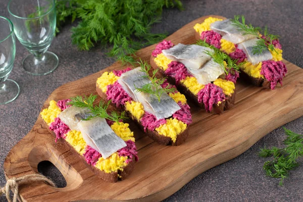 Homemade Sandwiches Salted Herring Beetroot Egg Wooden Board Brown Table — стоковое фото