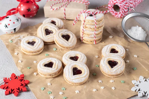 Christmas shortcrust cookies with red jam. Traditional festive Austrian cookies with jam. Linzer cookies