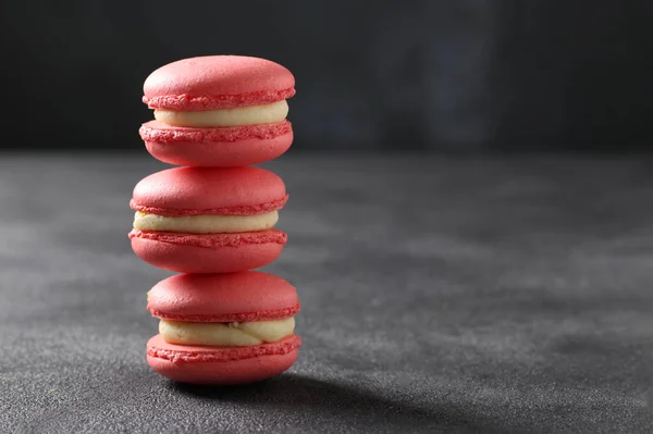 Bright pink french macaroons on gray background, Copy space