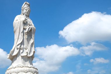the Guan Yim statue under the blue sky  clipart