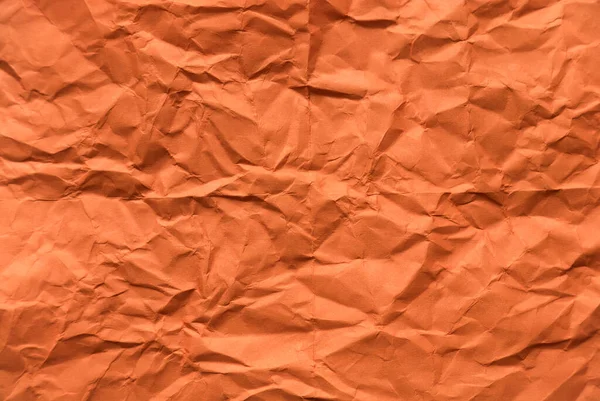 背景のオレンジ色の紙を丸めて — ストック写真