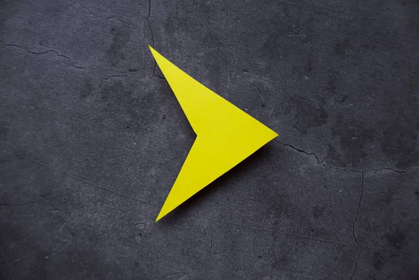 Yellow arrow pathway sign. Future life with direction or obsctacle reroute symbol. Business success concept.Dark floor background.