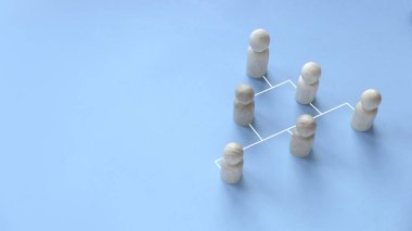 Company hierarchical organizational chart of blocks on blue background with copy space.
