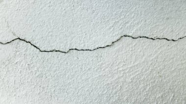 Horizontal Crack on Textured Wall Surface clipart