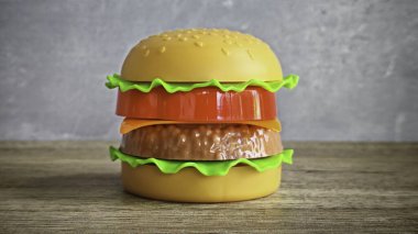 Tahta Masada Renkli Plastik Hamburger, Fast Food, Play veya Çocukluk Beslenmesini temsil ediyor