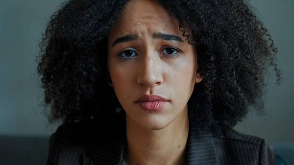 Portrait sad female african ethnic american girl student serious anxious looking at camera frustrated worried about breakup divorce upset depressed woman victim of bullying lady with health problem