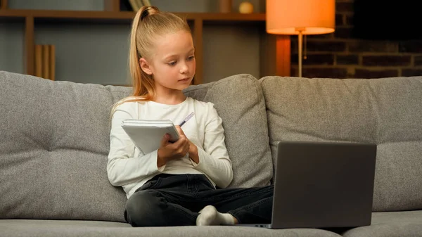 Blonde Little Smart Schoolgirl Pupil Listen Educational Lesson Laptop Home — Stockfoto