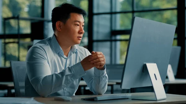 Asian man business consultant office worker recruiter communicating distant with client conference video chat male chinese businessman lawyer work on computer provide legal consultation online sales
