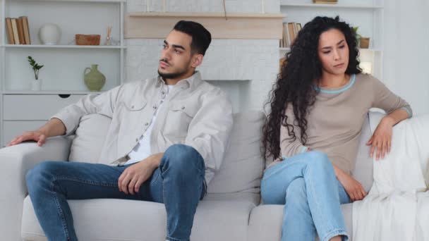Angry Hispanic Indian Man Husband Sitting Sofa Separately Sad Caucasian — Stock Video