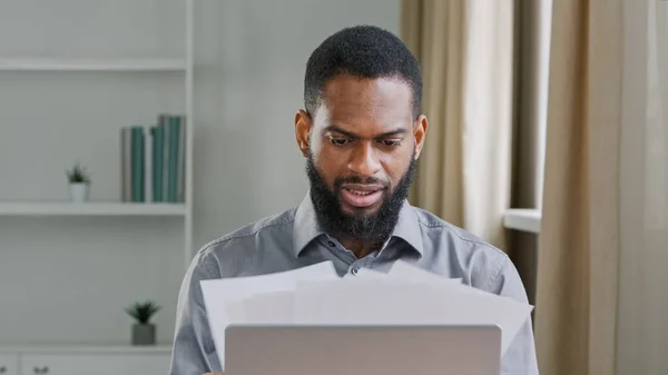 Pensive Millennial Ethnic Bearded Male Office Worker Analyzing Paperwork Serious — Stok fotoğraf