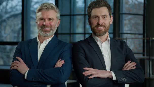 Two Successful Smiling Businessmen Posing Together Crossed Arms Young Mature — Stock video