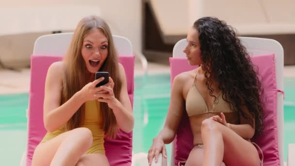 Excited Caucasian Hispanic Girlfriends Women Use Smartphone Win Discounts Hotel — Stock video