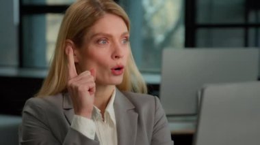 Caucasian middle-aged adult pensive woman mature business female 30s lady thoughtful businesswoman entrepreneur worker thinking employer in office think come up with idea find solution typing computer