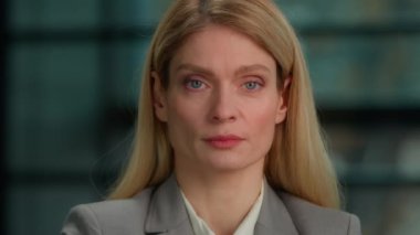 Beautiful smiling toothy dental smile happy female face Caucasian mature middle-aged adult woman looking at camera posing alone in office millennial businesswoman professional close up front portrait