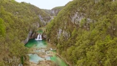 Plitvice lakes national park aerial view Croatian lake mountains forest wood river nature flying drone footage. Waterfall landscape explore World tourism outdoors panoramic rainforest copter shooting