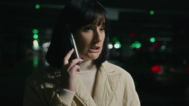 Angry businesswoman talk phone stressed woman call with smartphone at parking lot lady female annoyed with taxi car order lateness looking around quarrel conflict with phone arguing mobile cell talk