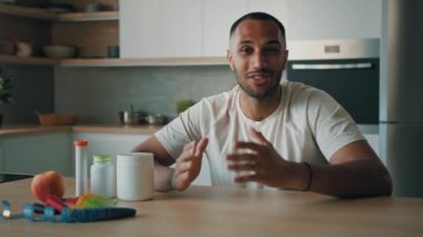 Webcam view male nutritionist consultation sporty influencer blogger talking African male man fitness trainer talk about nutrition sporty diet protein sport food supplement has video call chat online