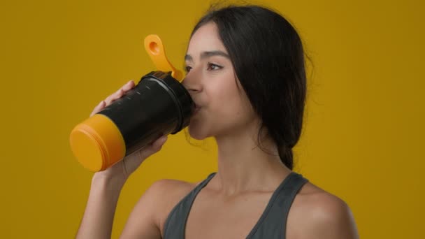 Portrait Female Yellow Studio Drinking Water Enjoy Hydration Ethnic Indian — Vídeo de Stock