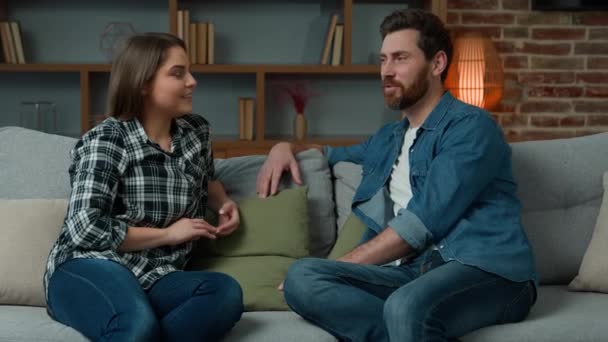 Young Couple Caucasian Hispanic Partners Husband Wife Sit Sofa Female — Stockvideo