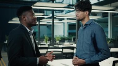 Business meeting two colleagues men shake hands at office accept project teamwork male partnership indian businessman consult african man client agree congratulate successful pact handshaking gesture