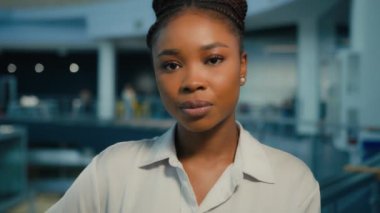 Close-up business portrait headshot serious pensive sad calm African American businesswoman girl ethnic female entrepreneur executive manager lawyer lady feminist employer worker looking at camera