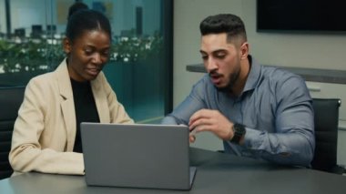 African American businesswoman leader expert mentor business coach help Arabian Indian man worker businessman with online mistake work with laptop manager shock wonder failure insight with computer