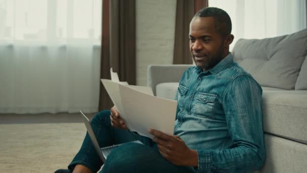 Mature African American Man Sitting Living Room Reading Documents Ethnic — Αρχείο Βίντεο