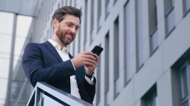 Smiling Happy Handsome Caucasian Man Holding Mobile Phone Checking Email — Vídeos de Stock