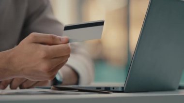 Unknown people in bank using cashless payment with virtual money. Close up male hand unrecognizable man agent manager give credit card to woman client of financial service paying technology e-commerce