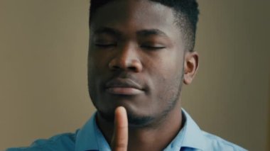 African american businessman 30s man employee worker investor ethnic multiracial male portrait indoors waving head disagree negative position shaking finger NO deny reaction disbelief reject bad offer