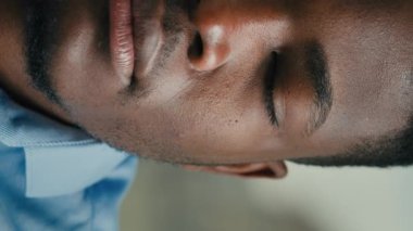 Vertical view close-up half part face African American ethnicity man adult businessman 30s entrepreneur manager lawyer banker professional agent male office worker confident business portrait indoors