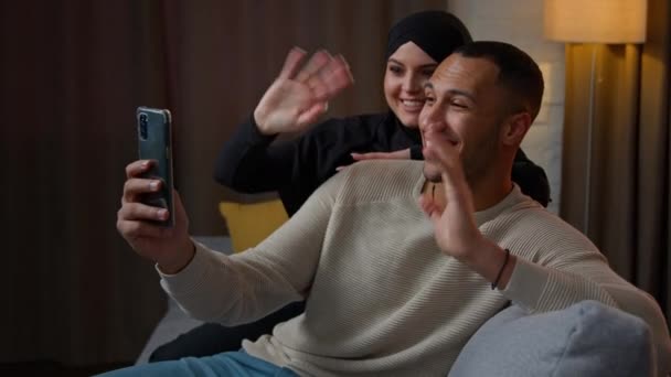 African American Muslim Couple Holding Video Call Conversation Home Virtual — стоковое видео