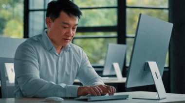 Mature asian japanese korean chinese 45s man office worker middle-aged businessman entrepreneur work in business company develop computer game program browsing online website technology development