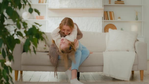 Caucasian Loving Mother Hug Cuddle Embrace Little Daughter Tickles Put — Αρχείο Βίντεο