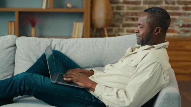 Mature African American Businessman Freelancer Typing Laptop Working Internet Lying — Stockvideo