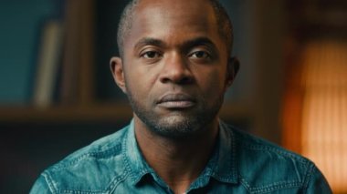 Close-up male portrait serious sad lonely mature african american man looking at camera desperate unhappy hopeless middle-aged ethnic businessman posing indoors crisis problem concept moving footage