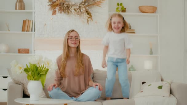 Mindful Calm Caucasian Mother Glasses Meditating Sitting Sofa While Active — Stockvideo