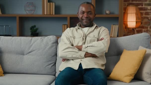 Mature African American Man Sitting Hands Folded Sofa Living Room — Video Stock