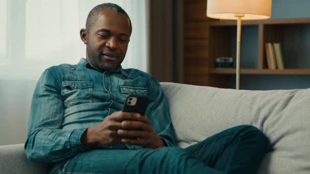 Relaxed Mature African American Man Sitting Comfortable Sofa Living Room — Video Stock